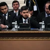 Trưởng phái đoàn phe đối lập Mohammad Alloush (giữa) tại cuộc hòa đàm ở Astana ngày 23/1. (Nguồn: AFP/TTXVN)
