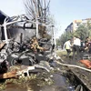 Hiện trường một vụ đánh bom xe ở phía tây Kabul ngày 24/7. (Nguồn: EPA/TTXVN)