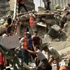 Lực lượng cứu hộ tìm kiếm người mất tích sau vụ động đất tại Mexico City ngày 19/9. (Nguồn: AFP/TTXVN)