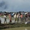 Người tị nạn Rohingya tại khu vực Ukhia, trên biên giới Bangladesh-Myanmar sau khi rời bỏ nhà cửa tránh xung đột ở Rakhine. (Nguồn: AFP/TTXVN)