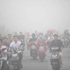  Khói mù ô nhiễm bao phủ khu vực Hàng Châu, tỉnh Chiết Giang, Trung Quốc ngày 26/9. (Nguồn: AFP/TTXVN)
