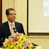 Đại sứ Việt Nam tại Trung Quốc Đặng Minh Khôi chúc mừng những thắng lợi và thành tựu to lớn mà nhân dân Lào anh em đã đạt được trong 63 năm qua. (Ảnh: Vĩnh Hà/Vietnam+)