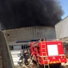 Hiện trường vụ cháy tại cụm công nghiệp Ngọc Hồi, huyện Thanh Trì, Hà Nội. (Ảnh: PV/Vietnam+)