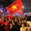 Người dân xuống đường mừng chiến thắng lịch sử của U23 Việt Nam (Ảnh: Lê Minh Sơn/Vietnam+)