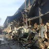 Hiện trường sau vụ cháy dãy nhà kho, xưởng của Công ty Rạng Đông. (Nguồn ảnh: Vietnam+)