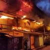 Hiện trường vụ cháy Công ty Bóng đèn phích nước Rạng Đông. (Nguồn ảnh: Vietnam+)