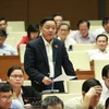 Bộ trưởng Trần Hồng Hà trả lời câu hỏi chất vấn của đại biểu Quốc hội chiều 6/11. (Ảnh: Hùng Võ/Vietnam+) 