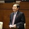 Bộ trưởng Bộ Nội vụ Lê Vĩnh Tân trả lời chất vấn các câu hỏi của đại biểu Quốc hội. (Nguồn ảnh: TTXVN) 