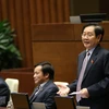 Bộ trưởng Bộ Nội vụ Lê Vĩnh Tân trả lời chất vấn các câu hỏi của đại biểu Quốc hội. (Nguồn ảnh: TTXVN)