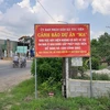 Biển cảnh báo của Ủy ban Nhân dân xã Tóc Tiên, thị xã Phú Mỹ, tỉnh Bà Rịa-Vũng Tàu về dự án ma. (Nguồn ảnh: TTXVN)