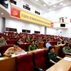 Cán bộ, chiến sĩ công an và các sở, ban, ngành tham dự hội nghị về công tác nhân quyền quy mô lớn nhất từ trước tới nay ở trên địa bàn tỉnh Lai Châu. (Ảnh: PV/Vietnam+)