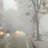 Hiện tượng sương mù sáng 2/2. (Ảnh: PV/Vietnam+)