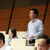 Bộ trưởng Đặng Quốc Khánh giải trình, làm rõ một số vấn đề đại biểu Quốc hội nêu. (Ảnh: An Đăng/TTXVN)