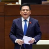 Bộ trưởng Bộ Công thương Nguyễn Hồng Diên trả lời chất vấn. (Ảnh: Phạm Kiên/TTXVN)