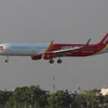 Chiếc tàu bay A321 mới của Vietjet hạ cánh xuống sân bay Tân Sơn Nhất. (Ảnh: Vietjet cung cấp)