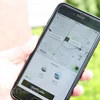 Hành khách gọi xe thông qua ứng dụng phần mềm của Uber. (Ảnh: Doãn Đức/Vietnam+)