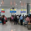 Hành khách làm thủ tục tại nhà ga T1 mới ở sân bay Phù Cát. (Ảnh: Vietnam Airlines cung cấp)