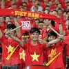 Các cổ động viên luôn cổ vũ hết mình cho đội tuyển bóng đá Việt Nam. (Ảnh: Quốc Khánh/TTXVN)