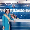Chị Lý Thị Thu Hương - nhân viên Phòng vé sân bay Tân Sơn Nhất của hãng hàng không Vietnam Airlines. (Ảnh: VNA cung cấp)