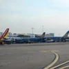 Máy bay của các hãng hàng không Vietnam Airlines và Vietjet. (Ảnh: Việt Hùng/Vietnam+)