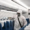 Máy bay Vietnam Airlines được khử trùng tránh virus corona. (Ảnh: Vietnam+)