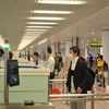 Hành khách nhập cảnh tại sân bay quốc tế Nội Bài. (Ảnh: Hoàng Anh/Vietnam+)