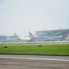 Máy bay của các hãng hàng không Việt Nam tại sân bay Nội Bài. (Ảnh: Việt Hùng/Vietnam+)