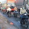 Quốc lộ 1, đoạn qua địa bàn tỉnh Tiền Giang đang bị hư hỏng, xuống cấp trầm trọng, không đảm bảo an toàn giao thông. (Ảnh: Minh Trí/TTXVN)
