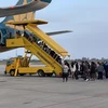 Vietnam Airlines tiếp tục thực hiện nghiêm các biện pháp phòng chống dịch để bảo vệ sức khỏe hành khách, người lao động. (Ảnh: CTV/Vietnam+)