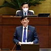 Bộ trưởng Bộ Y tế Nguyễn Thanh Long trả lời các câu hỏi chất vấn của đại biểu Quốc hội. (Ảnh: Phạm Kiên/TTXVN)