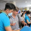 Vietnam Airlines Group đã phối hợp với các sân bay trên toàn quốc tăng cường quầy thủ tục, nhân sự mặt đất phục vụ hành khách. (Ảnh: CTV/Vietnam+)
