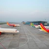 Máy bay của các hãng hàng không Việt Nam tại Cảng hàng không quốc tế Nội Bài. (Ảnh: CTV/Vietnam+)