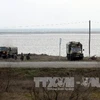 Binh sỹ Ukraine gác tại trạm kiểm soát ở dải đất thuộc khu vực tự trị Crimea ngày 8/3. (Nguồn: AFP/TTXVN)