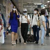 Người dân Hàn Quốc đeo khẩu trang trang đề phòng sự lây lan của dịch bệnh MERS. (Nguồn: AFP/TTXVN)