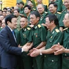 Chủ tịch nước Trương Tấn Sang gặp gỡ các cựu chiến binh Sư đoàn 313 và 314 - Quân khu 2. (Ảnh: Nguyễn Khang/TTXVN)