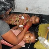 Một vụ học sinh tiểu học của Ấn Độ bị ngộ độc thực phẩm sau khi ăn trưa ở trường. (Nguồn: AP)