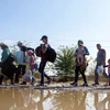 Người di cư tại thị trấn Gevgelija, Macedonia, sau khi qua biên giới Macedonia-Hy Lạp ngày 11/9. (Nguồn: AFP/TTXVN)