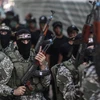 Các chiến binh Hamas tại thành phố Gaza. (Nguồn: THX/TTXVN)