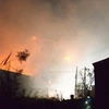 Lực lượng cứu hộ làm nhiệm vụ tại hiện trường vụ nổ ngày 13/10. (Nguồn: AFP/TTXVN)