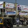Ápphích chân dung các ứng cử viên Quốc hội trên một đường phố ở Cairo. (Nguồn: AFP/TTXVN)