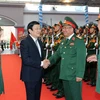  Chủ tịch nước Trương Tấn Sang với các cán bộ lãnh đạo Tổng cục Tình báo Quốc phòng. (Ảnh: Nguyễn Khang/TTXVN)