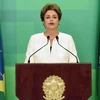 Tổng thống Brazil Dilma Rousseff phát biểu tại thủ đô Brasilia sau quyết định của Chủ tịch Hạ viện ngày 2/12. (Nguồn: AFP/TTXVN)