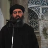 Thủ lĩnh IS Abu Bakr al-Baghdadi phát biểu trước các tín đồ Hồi giáo tại một đền thờ ở thành phố Mosul (Iraq) do IS kiểm soát ngày 5/7/2014. (Nguồn: AFP/TTXVN)
