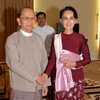 Tổng thống Myanmar U Thein Sein và Chủ tịch đảng NLD Aung San Suu Kyi. (Nguồn: THX/TTXVN)