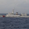 Tàu hải cảnh vũ trang của Trung Quốc đi vào lãnh hải Nhật Bản ngày 26/12/2015. (Nguồn: WSJ)