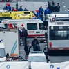 Cảnh sát và lực lượng cứu hộ Bỉ làm nhiệm vụ tại hiện trường vụ tấn công khủng bố ở ga tàu điện ngầm Maalbeek ngày 22/3. (Nguồn: AFP/TTXVN)