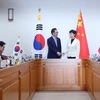 Thứ trưởng Ngoại giao Hàn Quốc Cho Tae-yul và Thứ trưởng Thương mại Trung Quốc Cao Yến tại kỳ họp. (Nguồn: YONHAP/TTXVN)