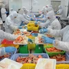 Dây chuyền sản xuất thủy hải sản đông lạnh tại nhà máy của Công ty CP Sài Gòn Food. (Ảnh: An Hiếu/TTXVN)