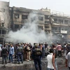 Hiện trường một vụ đánh bom đẫm máu ở thủ đô Baghdad. (Nguồn: AFP/TTXVN) 