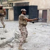 Lực lượng trung thành với Chính phủ đoàn kết dân tốc của Libya giao chiến với phiến quân IS tại Sirte ngày 28/8. (Nguồn: AFP/TTXVN)